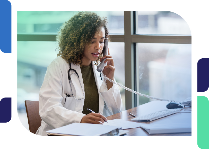 a female doctor on the phone at her desk